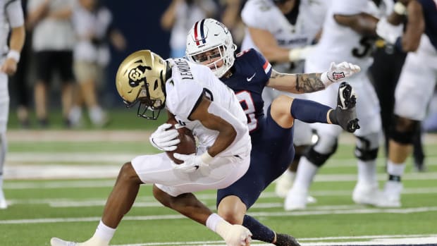 TUCSON, ARIZONA - OCTOBER 01: Wide receiver Montana Lemonious-Craig #1 of the Colorado Buffaloes is tackled by safety Gunner Maldonado #9 of the Arizona Wildcats during the second half of the NCAA football game at Arizona Stadium on October 01, 2022 in Tucson, Arizona. (Photo by Rebecca Noble/Getty Images)